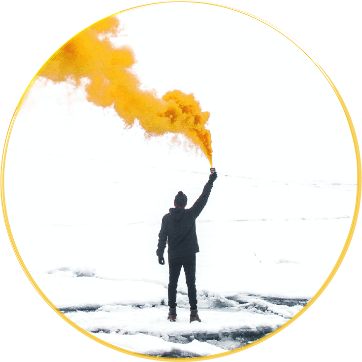 Marketing agency: Man on ice holding yellow smoke signal looking to be visible